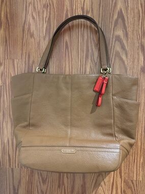 Coach Tan Leather Tote with Red Charm